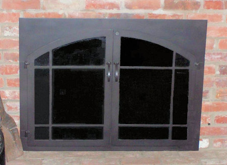 The Square to Arch window-pane (straight top window- pane bar)  All black finish twin doors with standard forged center handles,  smoke glass. Comes with slide mesh spark screen.